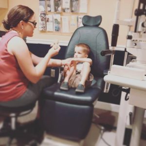 Asheville eye doctor Haley Perry, OD from Elite Eye Care gives child with eye turn eye exam