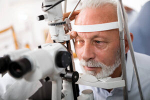 Doctor Checking Patient's Eyes in a slit lamp/microscope for eyes.
