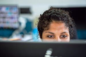 woman working/staring at computer